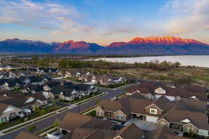 Aerial view at dusk of a residential view and a water and mountain view