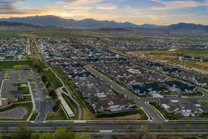 Aerial view of property's location featuring nearby suburban area and a mountain backdrop
