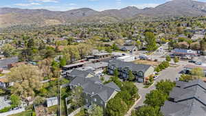 Aerial perspective of suburban area featuring a mountain backdrop