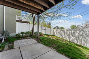 Fenced backyard with a patio area