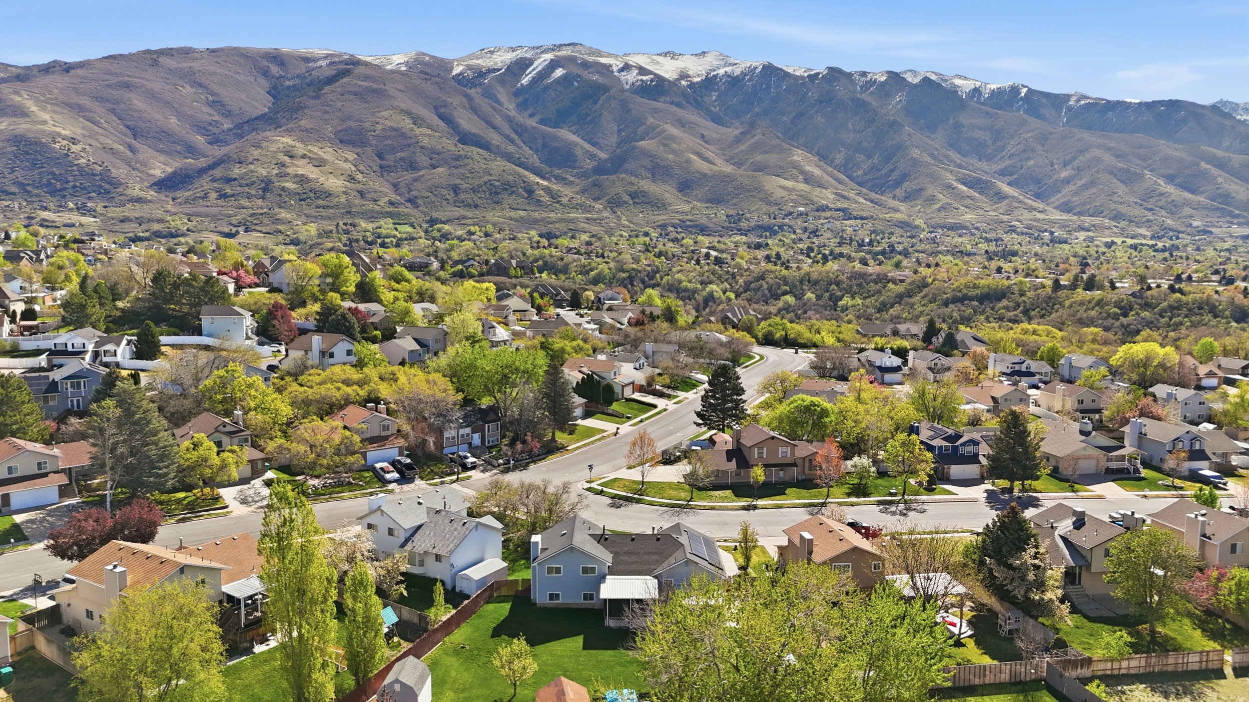 View of property location with nearby suburban area and a mountainous background