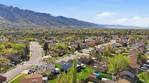 Aerial perspective of suburban area featuring a mountain backdrop