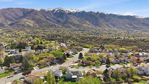 View of property location with nearby suburban area and mountains