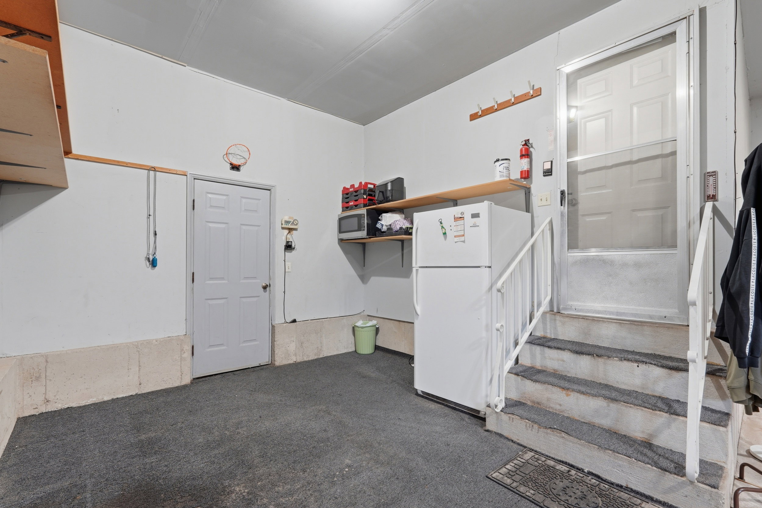 Garage with freestanding refrigerator