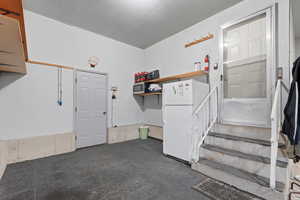 Garage with freestanding refrigerator