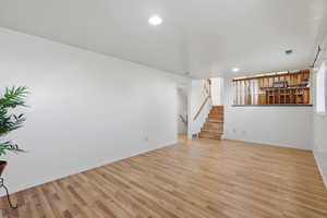 Unfurnished living room with light wood-style flooring and recessed lighting