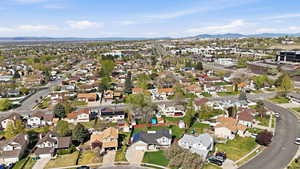 Aerial perspective of suburban area with a mountainous background