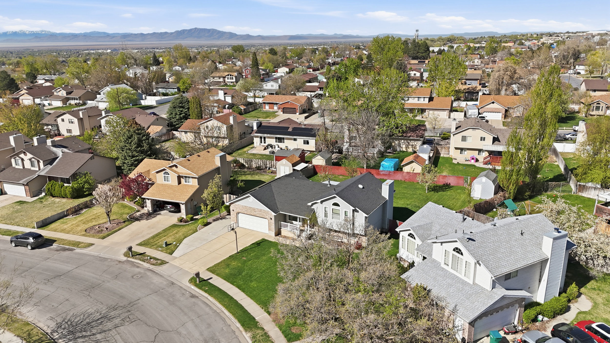 Aerial view of residential area featuring a mountain backdrop