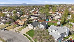 Aerial view of residential area featuring a mountain backdrop