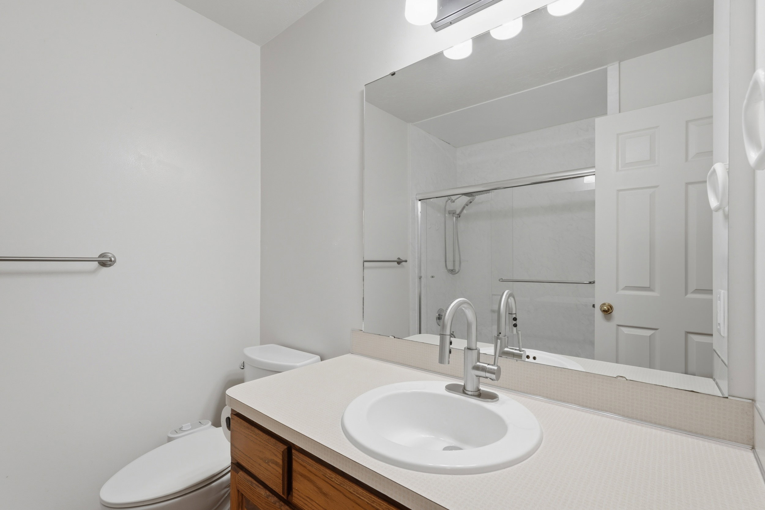 Bathroom with vanity and a shower