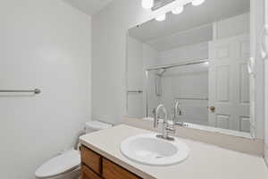 Bathroom with vanity and a shower