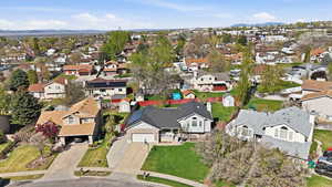 Aerial view of residential area with a mountainous background