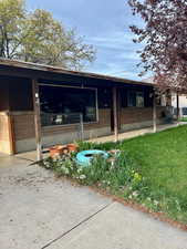 View of side of property featuring brick siding
