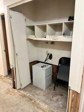 Unfurnished office featuring concrete flooring
