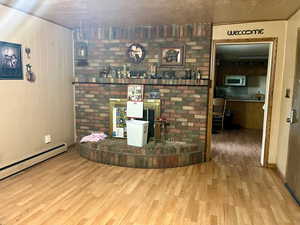 Living area featuring wooden walls and wood finished floors