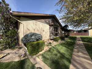 View of side of home with brick siding