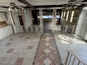 View of patio featuring ceiling fan