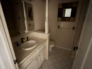 Bathroom with vanity and light tile patterned flooring