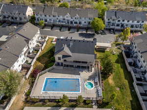 Aerial perspective of suburban area featuring a pool
