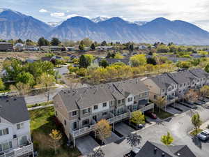 Aerial perspective of suburban area featuring a mountainous background