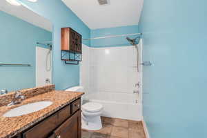 Full bath featuring vanity and bathtub / shower combination