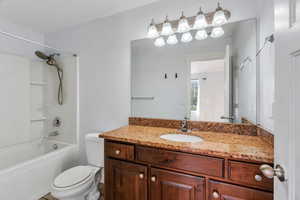 Full bathroom with vanity and tub / shower combination