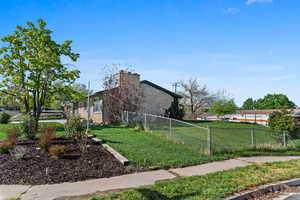 View of property exterior with a chimney
