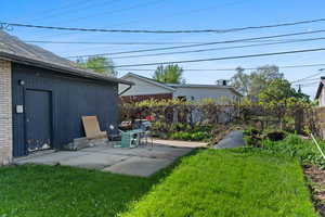 Fenced backyard with a patio