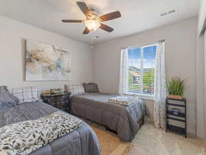 Bedroom featuring carpet and ceiling fan