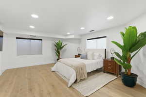 Bedroom featuring light wood-type flooring and recessed lighting