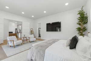 Bedroom with recessed lighting and wood finished floors