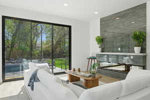 Living room featuring wood finished floors and recessed lighting