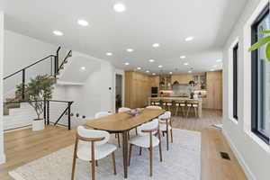 Dining space featuring recessed lighting and light wood-style floors