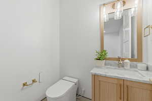 Bathroom featuring toilet and vanity