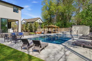 View of pool featuring patio surround, a gazebo, and outdoor lounge area