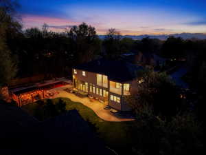 Back of property with an outdoor pool and a patio area