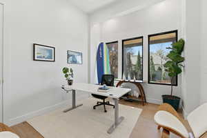 Office area featuring light wood finished floors
