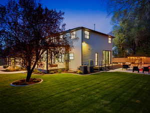 Back of house featuring a patio and an outdoor lounge area