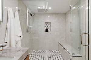 Full bath with a stall shower and vanity
