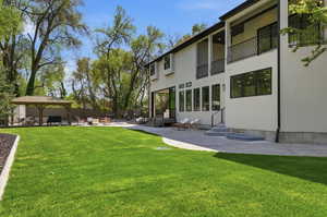 View of yard featuring a patio area and entry steps