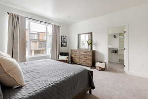 Primary bedroom with King bed, huge window and LARGE walk in closet