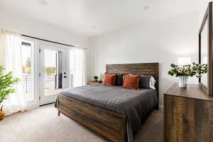 Bedroom with balcony and King bed.