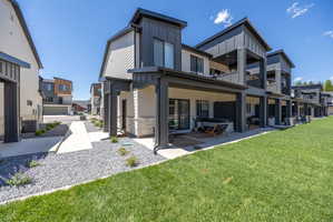 Modern multi-story exterior with dark vertical siding accents and light horizontal siding