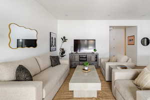 Large living room, door to the garage.