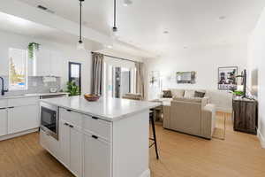 Large, new fully stocked kitchen combined with living area.