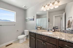 Full bathroom featuring vanity, a shower/tub, and tiled floor
