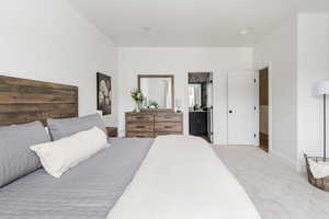 Primary bedroom with large walk in closet an ensuite bathroom. Great windows!