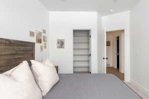 Large bedroom with large closet and King bed.