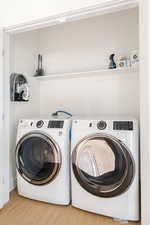 Laundry closet at the top of the stairs with brand new large capacity washer/dryer