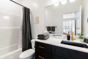 Ensuite bathroom with tub and shower combo